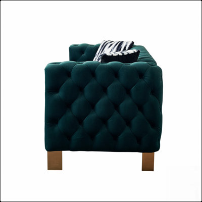 Canapé moderne en velours avec dossier capitonné et structure durable, pour plus de confort et de style dans tout espace de vie.