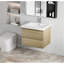 Meuble-lavabo flottant avec lavabo, conception murale pour une décoration de salle de bain moderne et peu encombrante.