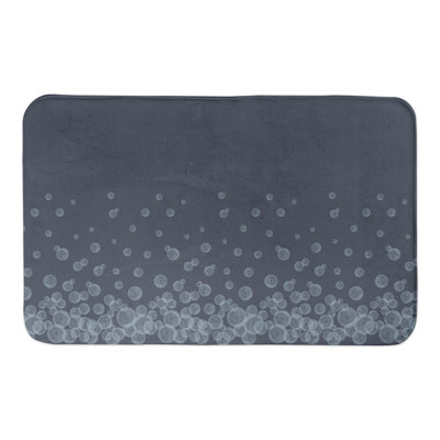 Tapis de bain bulles sur fond bleu