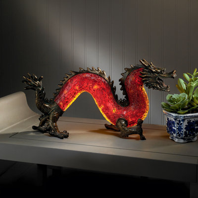 Statue de dragon dansant de lumière illuminée