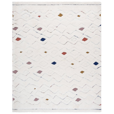 Doneshia Hand Tufted Wool/Cotton Southwestern Rug in Ivory/Rust