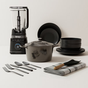 Ninja blender, plates, bowls, cookware, utensils and dish towel.