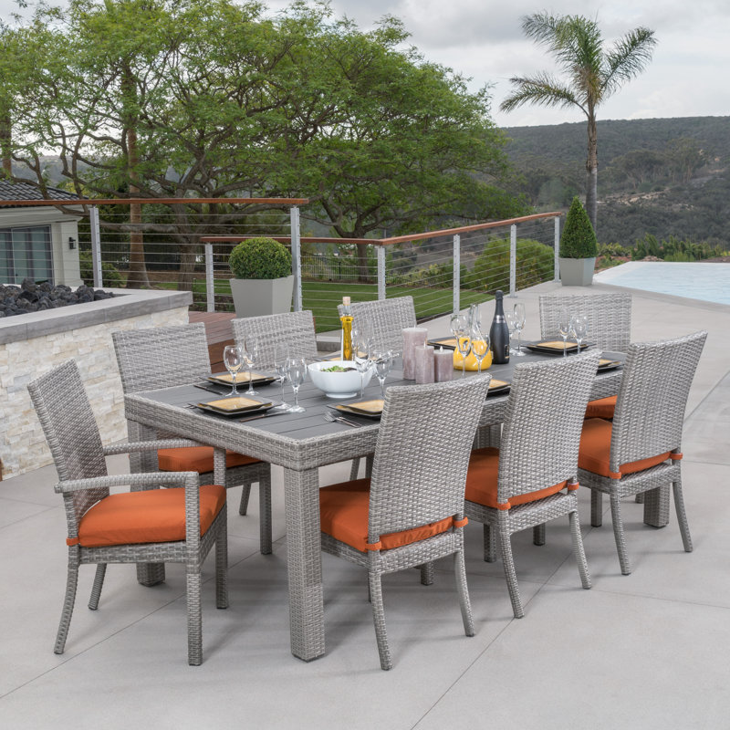 Fionnula 8-Person Rectangular Patio Dining Set with Sunbrella Cushions, Gray Frame/Tikka Orange Cushion