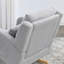 Fauteuil à bascule décontracté de couleur grise avec coussin lombaire extra confortable