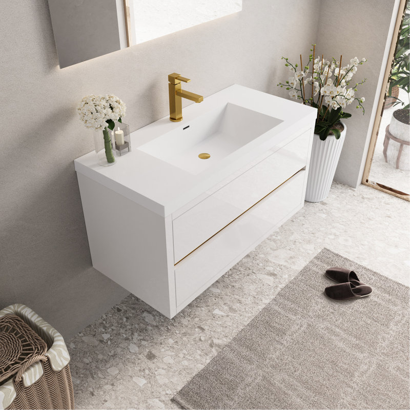 Meuble-lavabo avec rangement suspendu mural, comptoir en résine de pierre blanche brillante, tiroirs à fermeture en douceur, préassemblé pour une rénovation de rangement rapide et pratique en blanc.