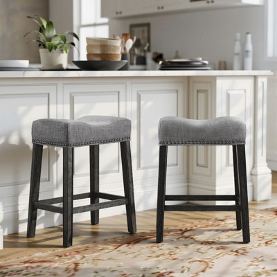 Oenone Backless Bar Stools, Upholstered Saddle Seat With Nailhead Trim, Weathered Wood Legs - Set of 2