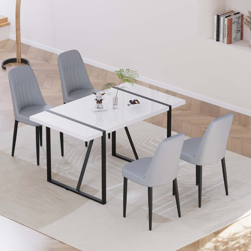 Ensemble de table de salle à manger moderne 55 po pour 4 personnes avec pieds en métal et chaises rembourrées en polyuréthane
