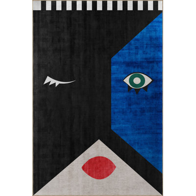 Tapis bleu-noir à motifs abstraits