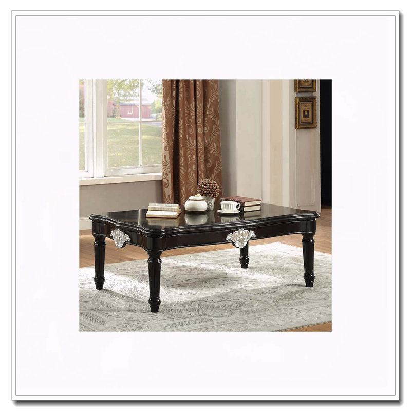 Table basse noire avec pieds tournés