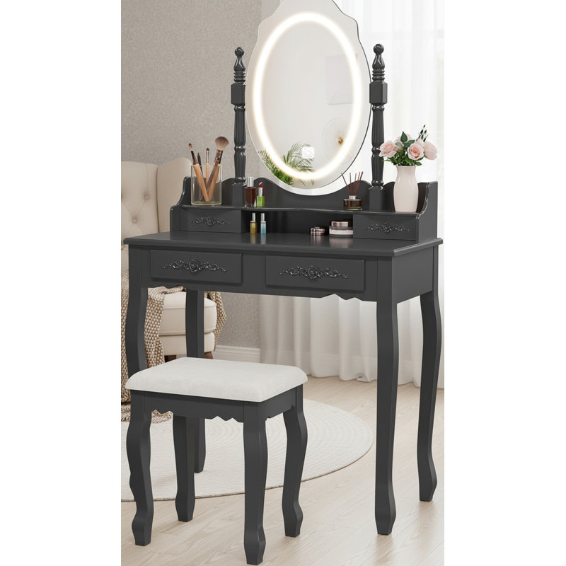 L'ensemble de coiffeuse moderne noir est livré avec un miroir de lampe, un éclairage réglable tricolore, quatre tiroirs et un tabouret rembourré, spécialement conçu pour la chambre à coucher.