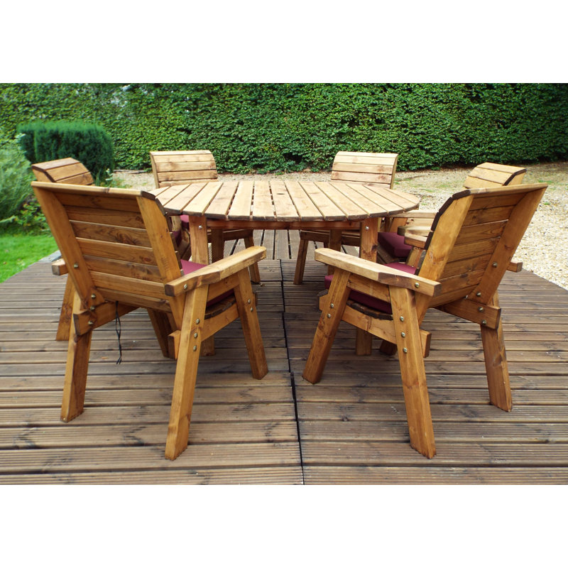 Faust 6 - Person Wood Patio Dining Set with Round Table , Cushions Included, Burgundy