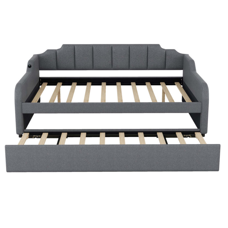 Lit de jour rembourré avec lit gigogne et chargement USB, conception polyvalente pour la vie moderne et les chambres d'amis.