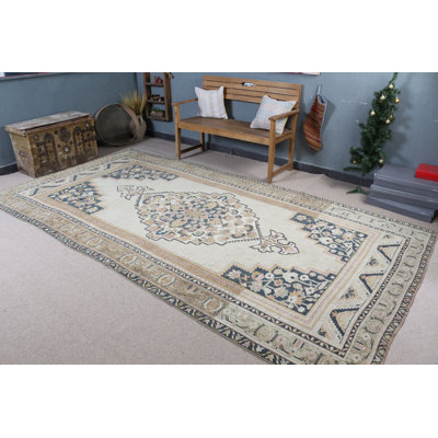 Elegant Turkish Rug in Beige and Navy Tones Featuring Intricate Floral Patterns for Home Decor