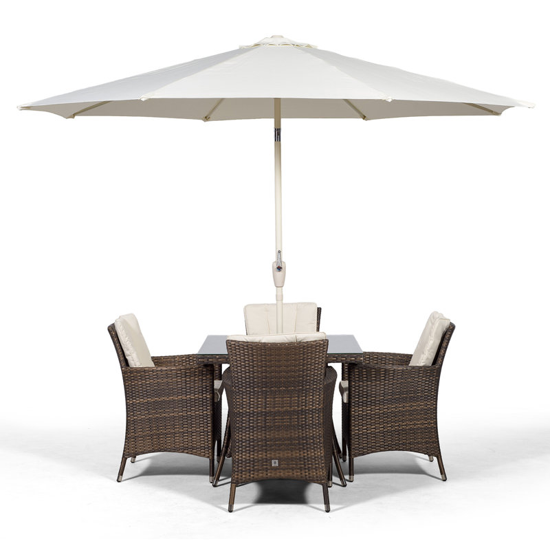 Karcher 4 - Person Wicker Patio Dining Set with Square Table , Cushions Included, Brown