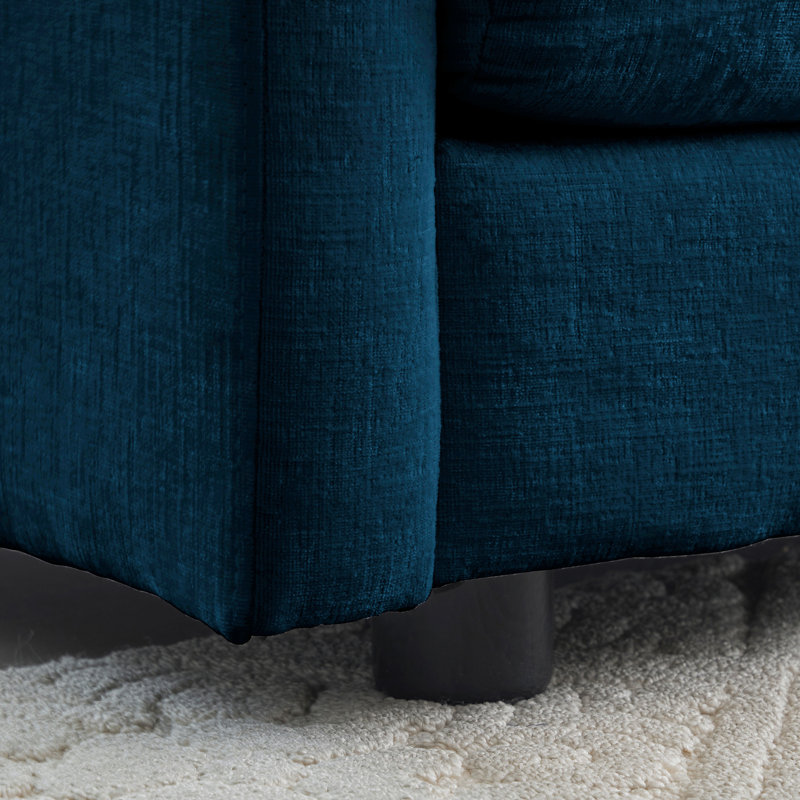 Canapé d'angle en chenille bleue en forme de U, 5 places avec repose-pieds réversible et 2 poufs, structure en bois massif, revêtement de qualité et fabrication soignée.