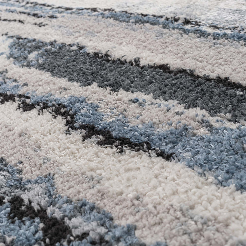 Tapis tissé à rayures bleues
