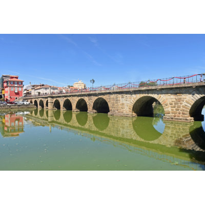Roman Bridge Of Chaves by Curtoicurto - Wrapped Canvas Print