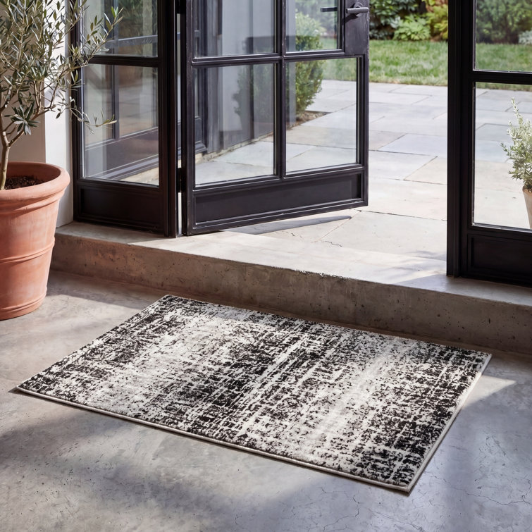 Riebe Black Area Rug