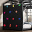 Lit plateforme en métal en forme de maison ClimbNest pour enfants, avec mur d'escalade et toboggan.-134981015