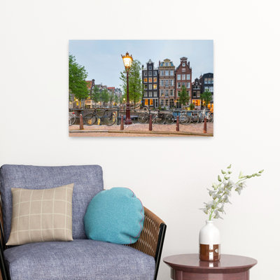 Bikes And Houses Along Canal At Dusk At Intersection Of Herengracht And Brouwersgracht Amsterdam North Holland Netherlands Abstract Contemporary Ar...