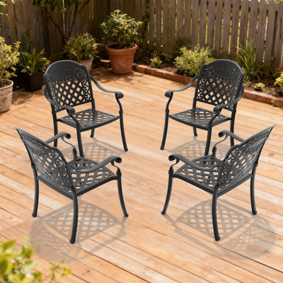 Mobilier de patio en fonte d'aluminium à 4 chaises avec structure noire et coussins rouges, motifs de pétales, revêtement haute température, sièges confortables, fonction empilable, motifs de chaises antidérapantes en tissu à l'épreuve du soleil
