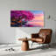Arbre aux fleurs roses sur un rivage rocheux au coucher du soleil, tableau sur toile-161821882