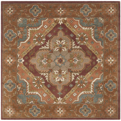 Ezell Hand Tufted Wool/Cotton/Latex Floral Rug in Rust