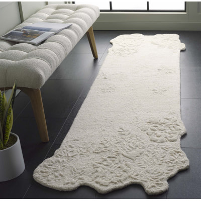 Devna Hand Tufted Wool/Cotton Floral Rug in Ivory