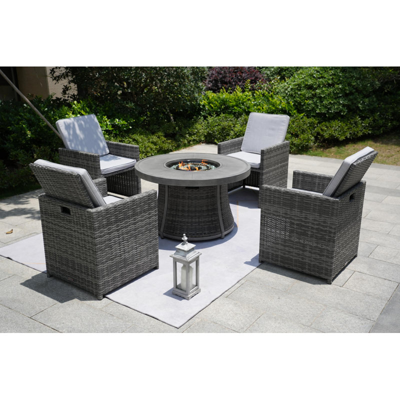 Areefa 4 - Person Wicker Patio Dining Set with Round Table