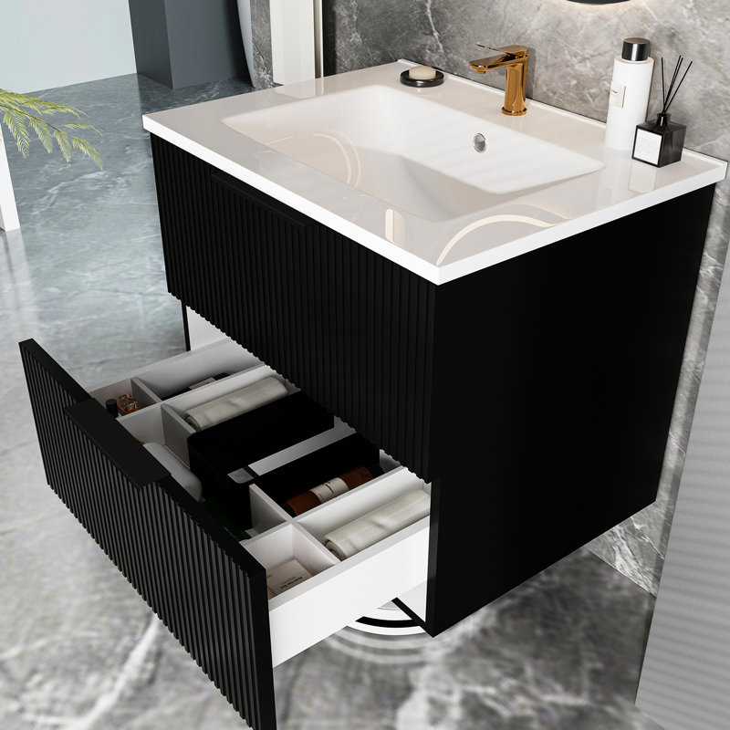 Meuble-lavabo suspendu noir moderne de 61 cm (24 pouces) avec lavabo en céramique et tiroir en forme de U, grand espace de rangement pour les produits de soins personnels. Tiroirs cannelés pour une durabilité accrue et une ouverture/fermeture fluide.