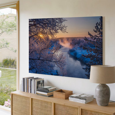 Canvas A Serene Winter Landscape Featuring A Tranquil River Winding Through Wall Art A Snow Covered Forest The Foreground Is Adorned Canvas Wall Art