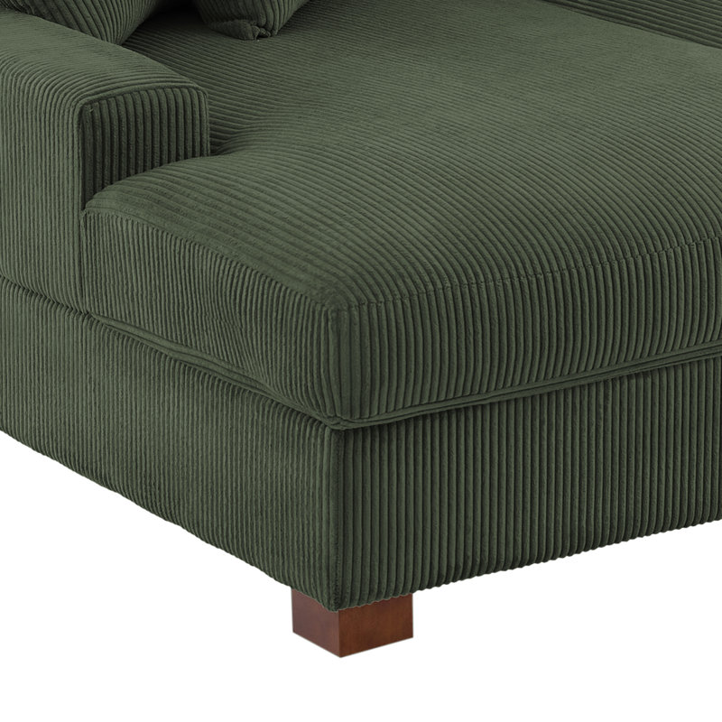 Très grand canapé-lit rembourré en velours côtelé vert avec accoudoirs et coussins décoratifs, Vert