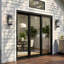 Black 1-light Outdoor Wall Lantern Sconce With Mirror Reflector