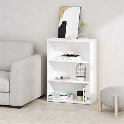 A Pure White, Minimalist Three-Tiered Storage Bookcase, Its Compact Size Makes It Suitable For Living Rooms, Bedrooms, And Home Offices.