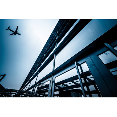 Airplane Fly Above City by Shansekala - Wrapped Canvas Print