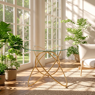 Table de salle à manger EGO, plateau en verre trempé et structure en métal doré, dimensions : 90 cm (L) x 90 cm (P) x 74 cm (H).