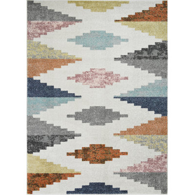 Tapis géométrique tissé à la machine Cherrel en polypropylène gris / jaune / bleu