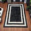 Tapis noir et blanc à bordure en cuir de vache_8 x 10 pi-655346655