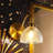 Modern 1-Light Gold Wall Sconce with Spiraled Ribbed Glass