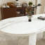 Table de salle à manger ovale avec plateau en marbre et base robuste-1077903683