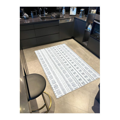Tapis décoratif bleu à motif géométrique excentrique lavable à la machine
