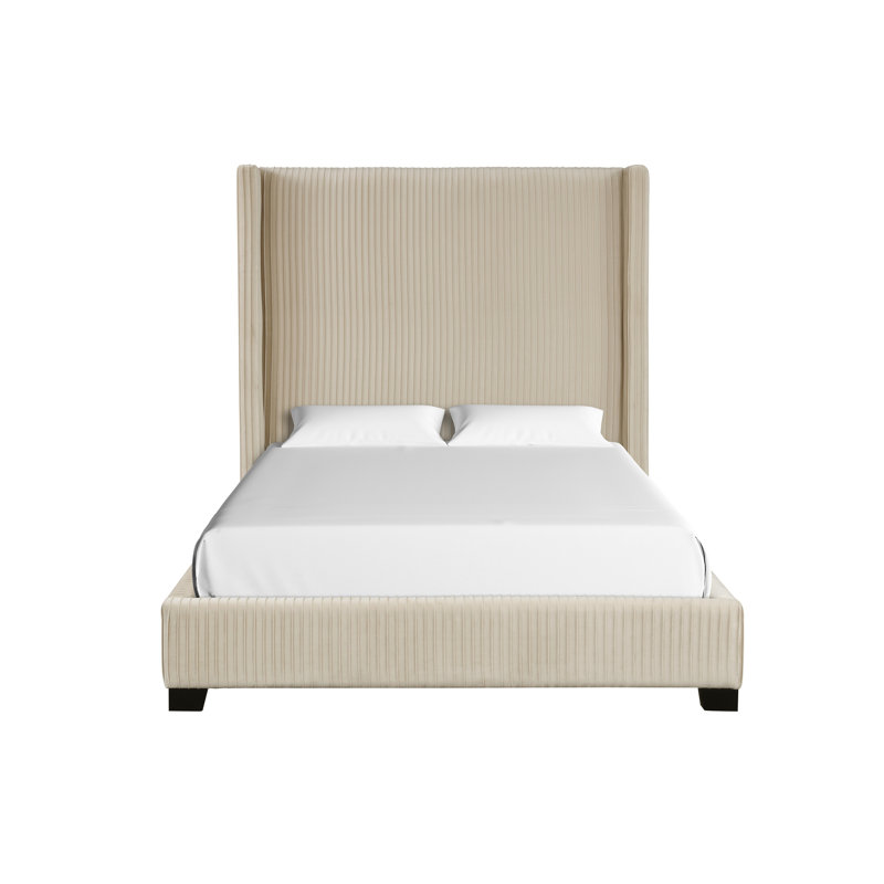 Grand lit tapissier dans une boîte beige