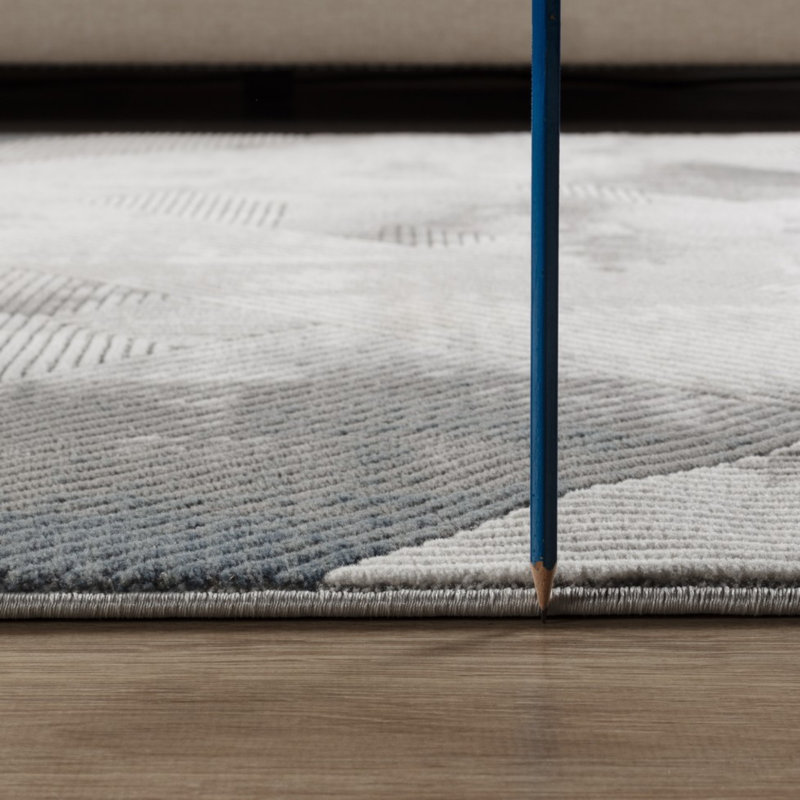 Tapis géométrique en polyester résistant aux taches, idéal pour les espaces de vie modernes