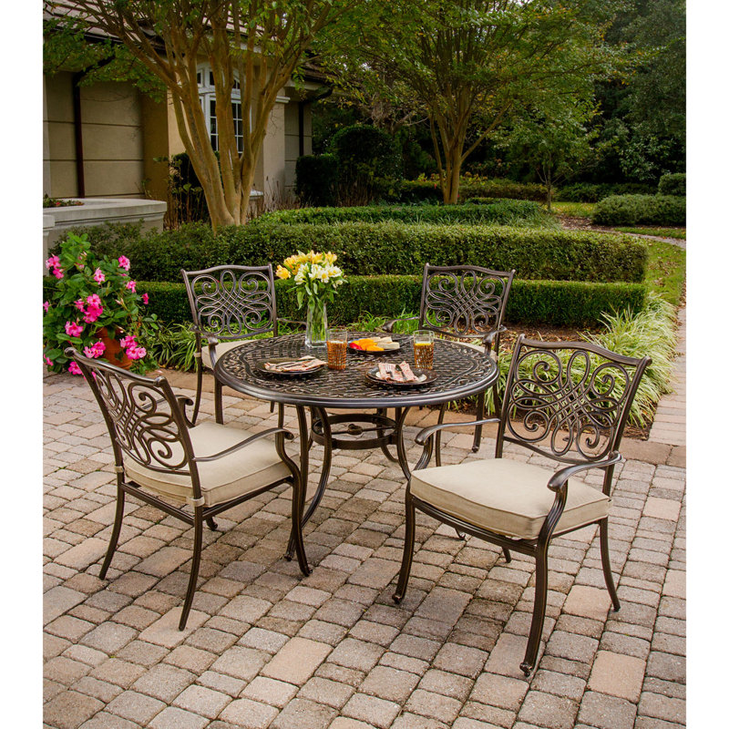 Burroughs 4 - Person Patio Dining Set with Round Table , Cushions Included