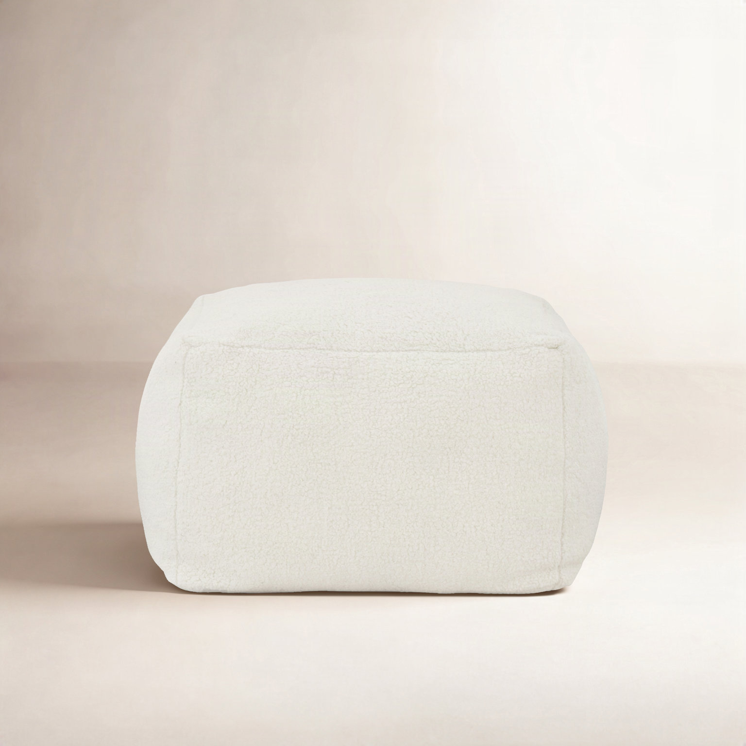 Inaki Upholstered Pouf, White Faux Lams Wool