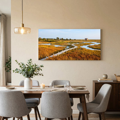Winding Wooden Boardwalk Through Golden Coastal Marsh Landscape Canvas Wall Art 47 x 24 x 1.5 Inch