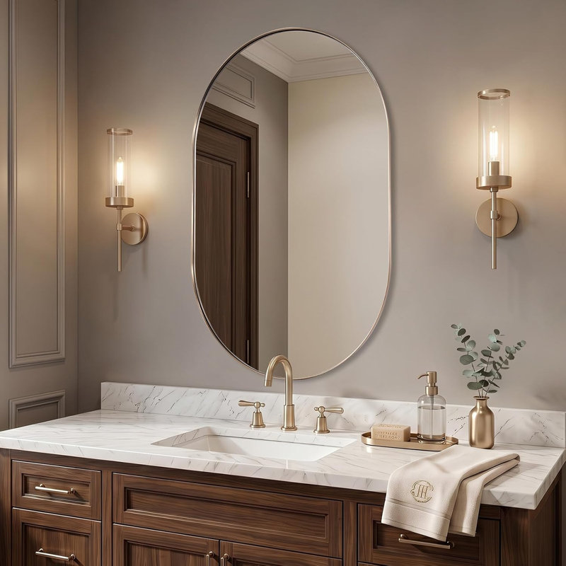 Miroir de salle de bain Kaitlee Cadre en acier inoxydable, 40 po x 24 po, Pilule, Champagne Bronze