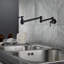 Robinet de cuisine mural rétractable