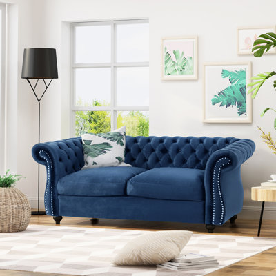 Deep In Navy Blue Velvet For A Comfortable Lounge Area With Nailhead Trim And Tufting