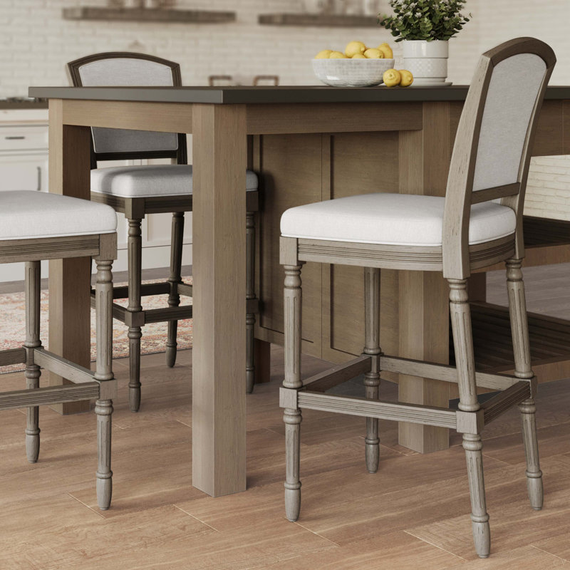 Tabouret de bar gris patiné avec assise et dossier rembourrés gris